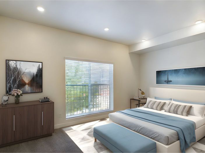 A modern bedroom in Apartments in Ogden features a large window, white walls, a double bed with blue and white bedding, a cushioned bench, a wooden cabinet, and two landscape paintings.